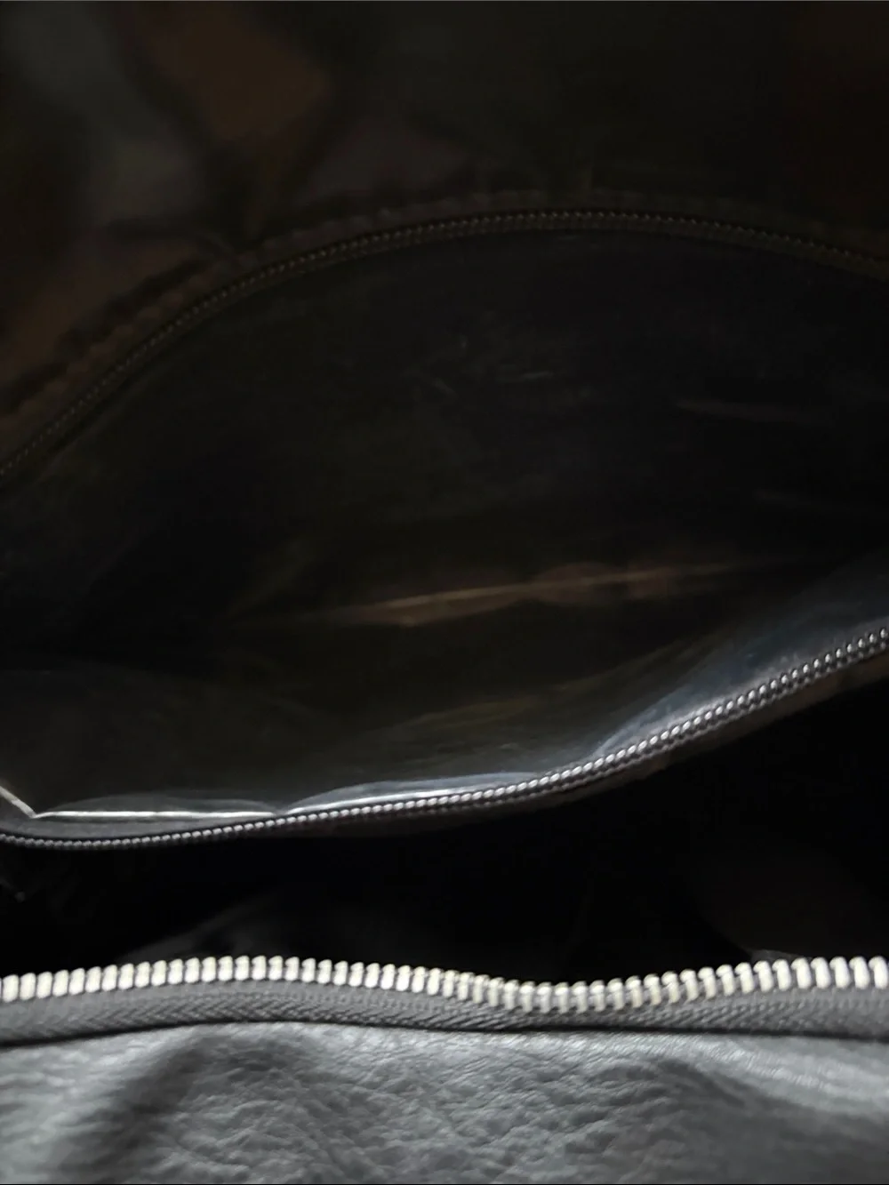 The Honest Company Black Vegan Leather Diaper Bag backpack model cross country